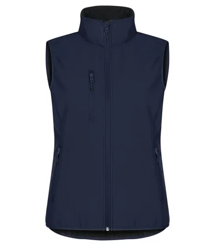 Gilet softshell Classic donna — Smanicato softshell in poliestere riciclato. Tessuto triplo strato elasticizzato, idrorepellente e antivento. Tre tasche esterne con zip. Due tasconi interni. Giromanica e fondovita elasticizzati.